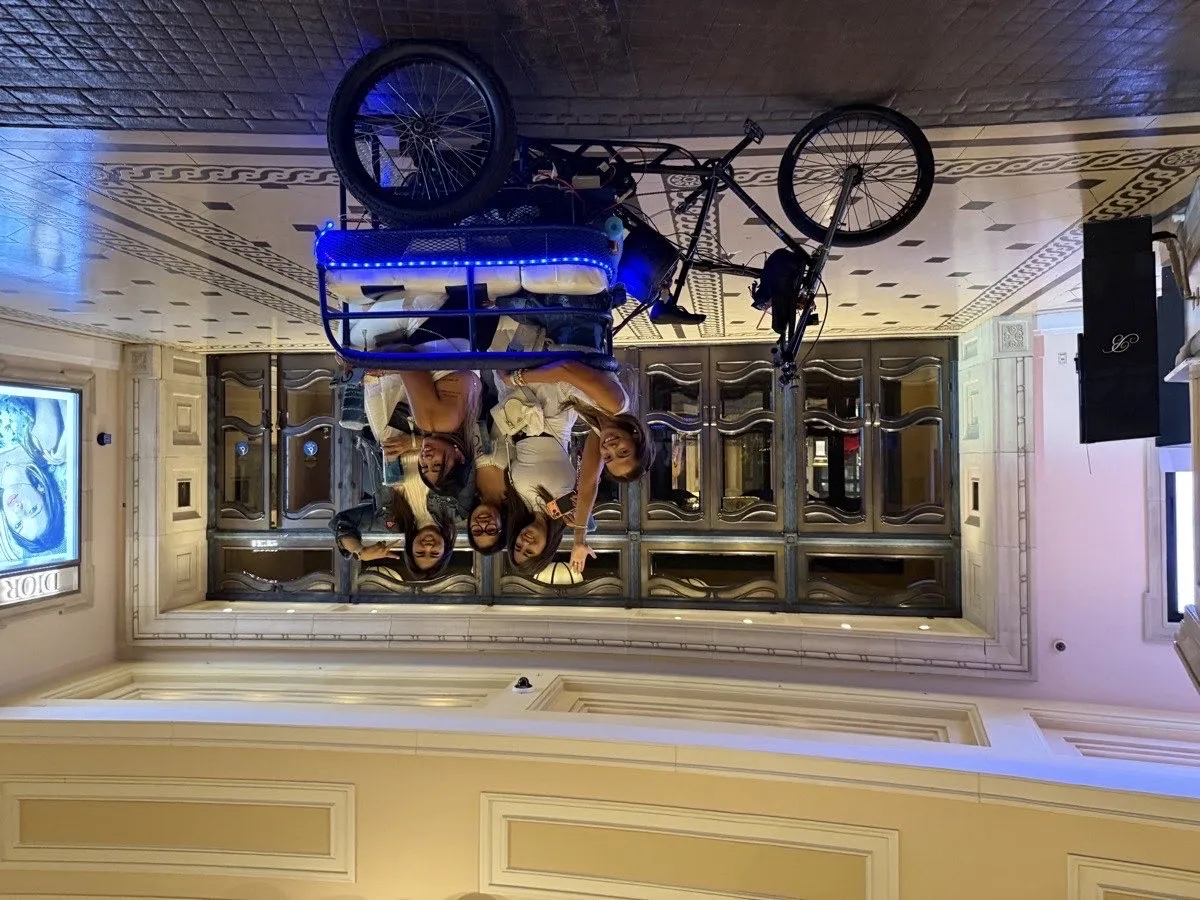 Group of guests boarding a Vegas Bike Cab pedicab at a Las Vegas casino entrance
