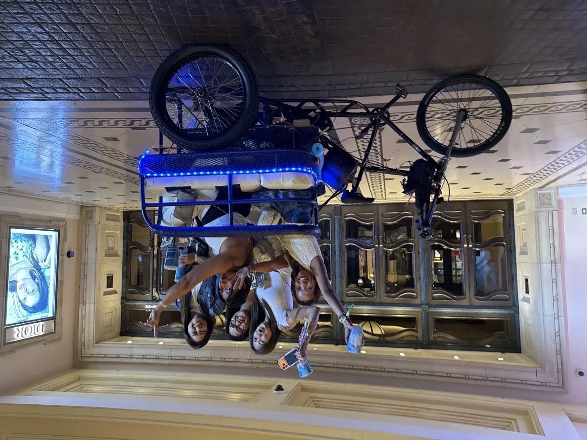 Illuminated Vegas Bike Cab pedicab on the Las Vegas Strip after dark